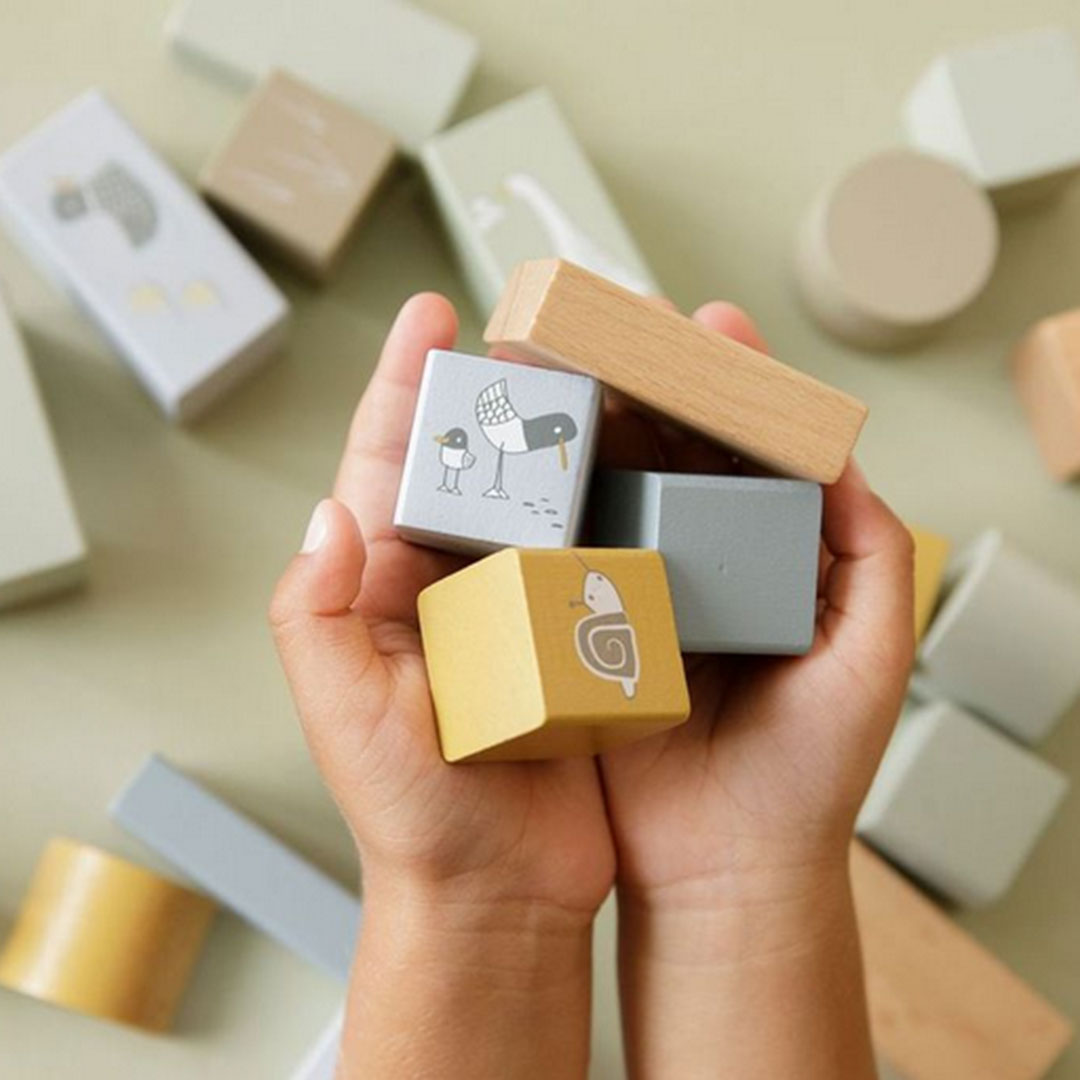 Wooden building blocks in a blue box