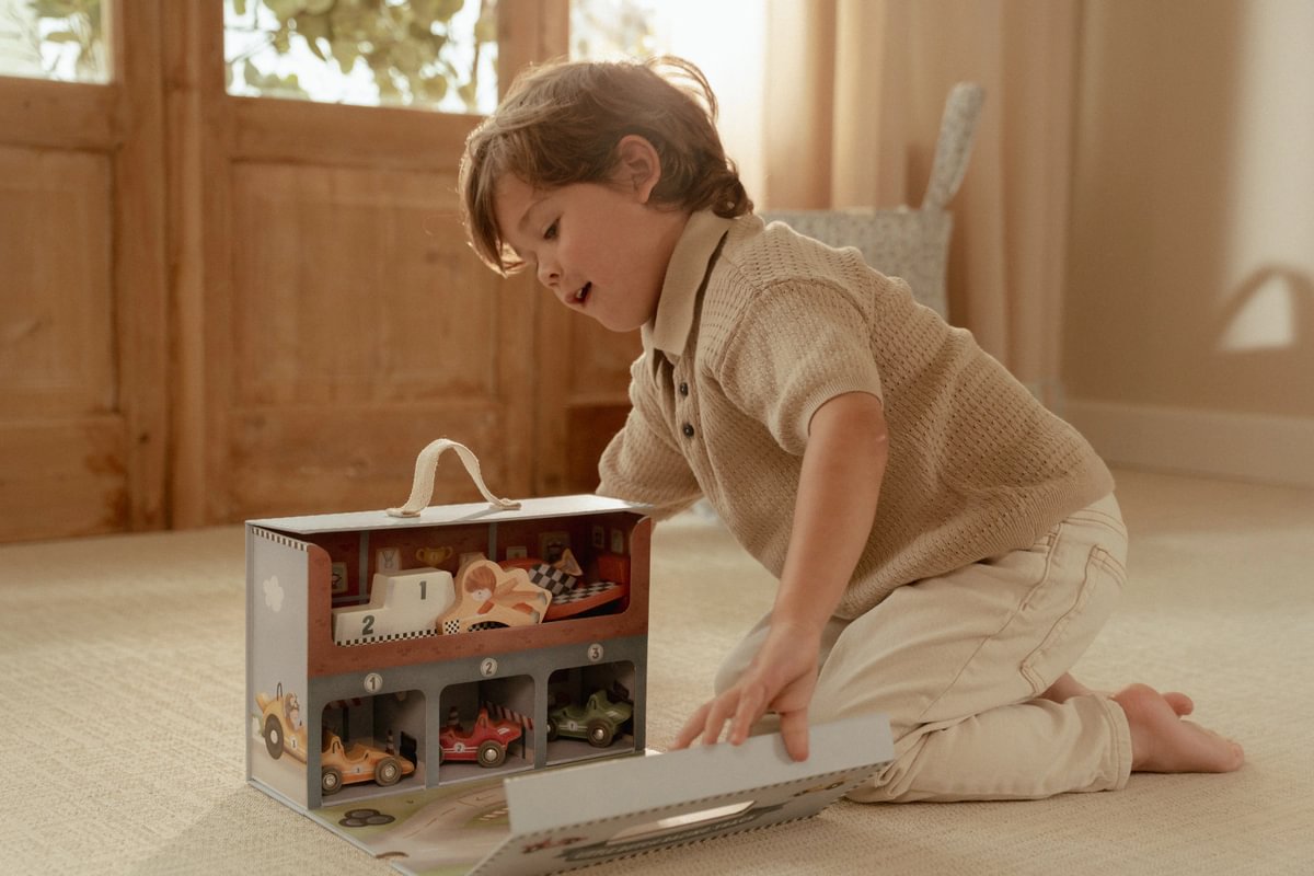 Toy suitcase with race track