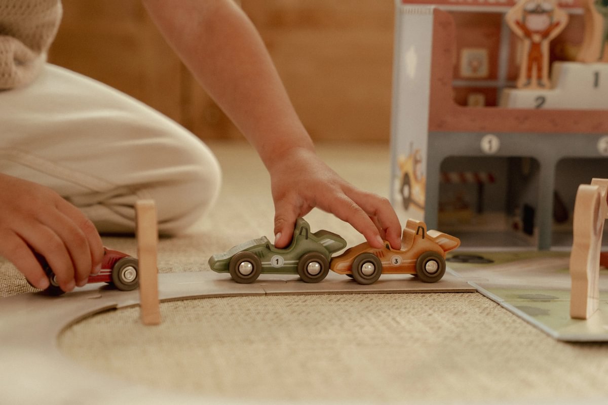 Toy suitcase with race track